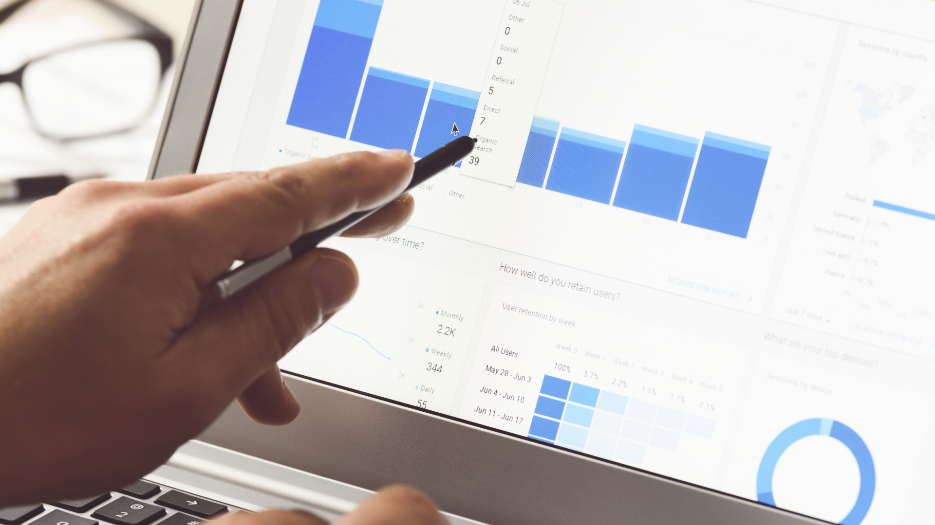 A person analyzing a graph, representing data-driven insights and strategies for search engine optimization (SEO).